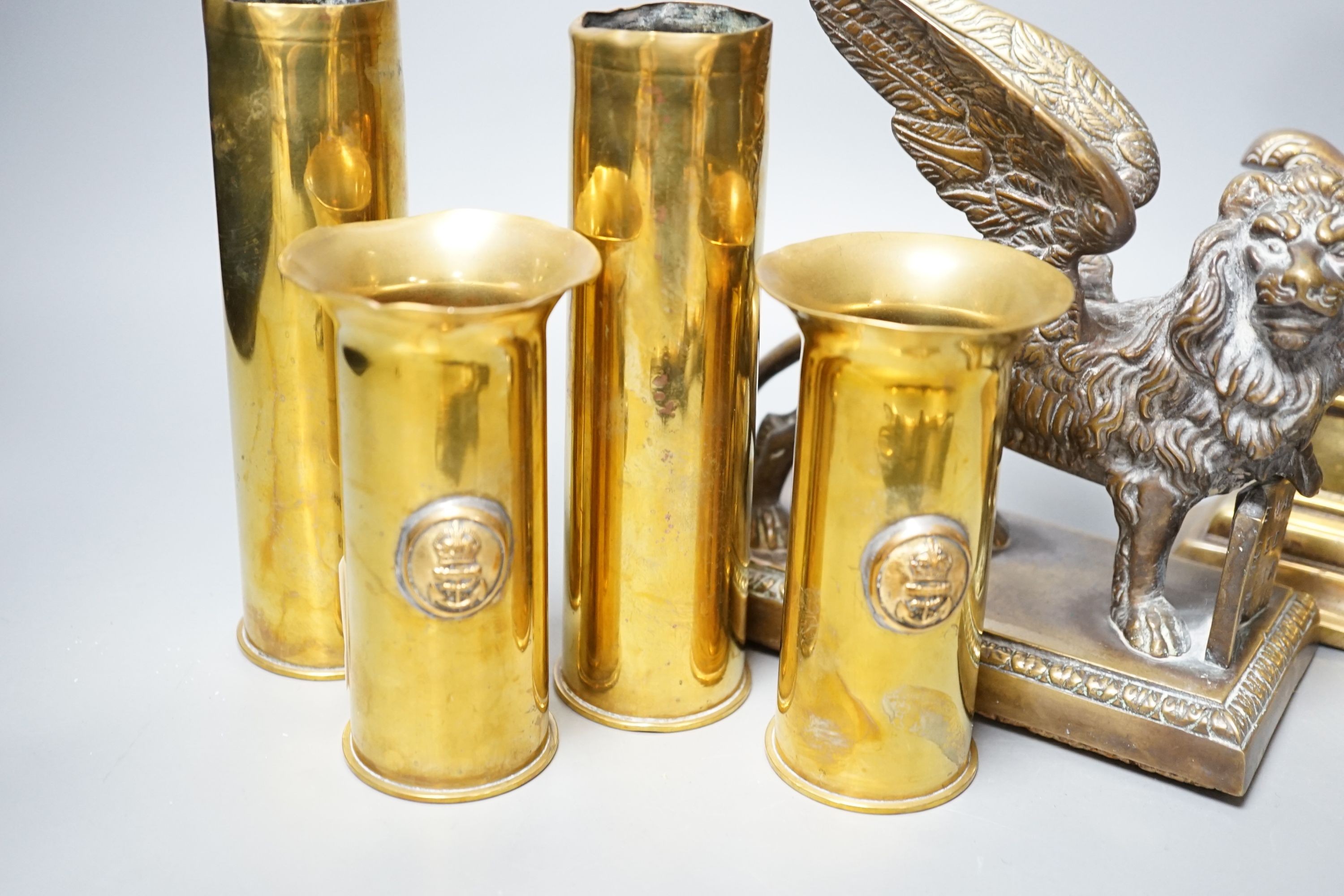 A brass ‘bat’ pin tray, two lion figures and sundry metalware, lion door stop 20 cms height x 25 cms width